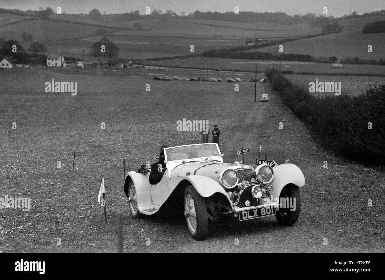 Jaguar SS100 at the Standard Car Owners Club Southern Counties Trial, 1938. Artist: Bill Brunell. Stock Photo