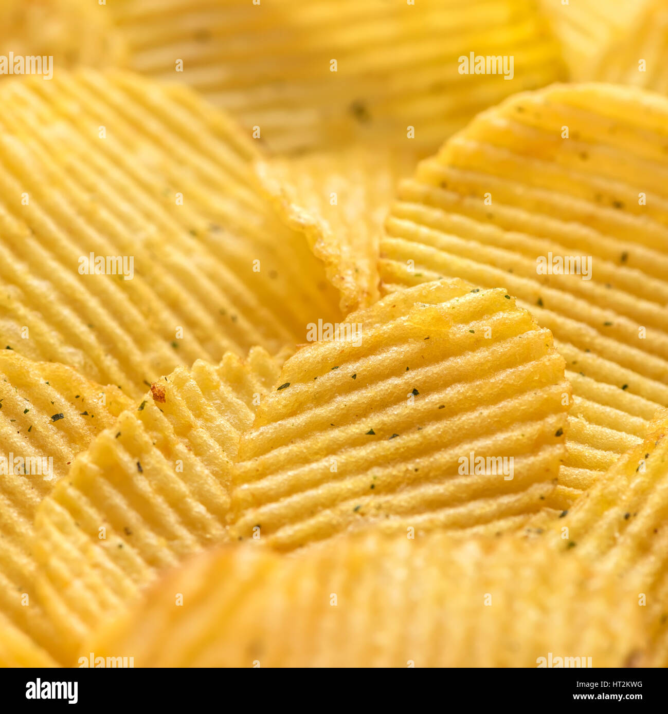 close up rippled natural potato chips with salt and greenery Stock ...