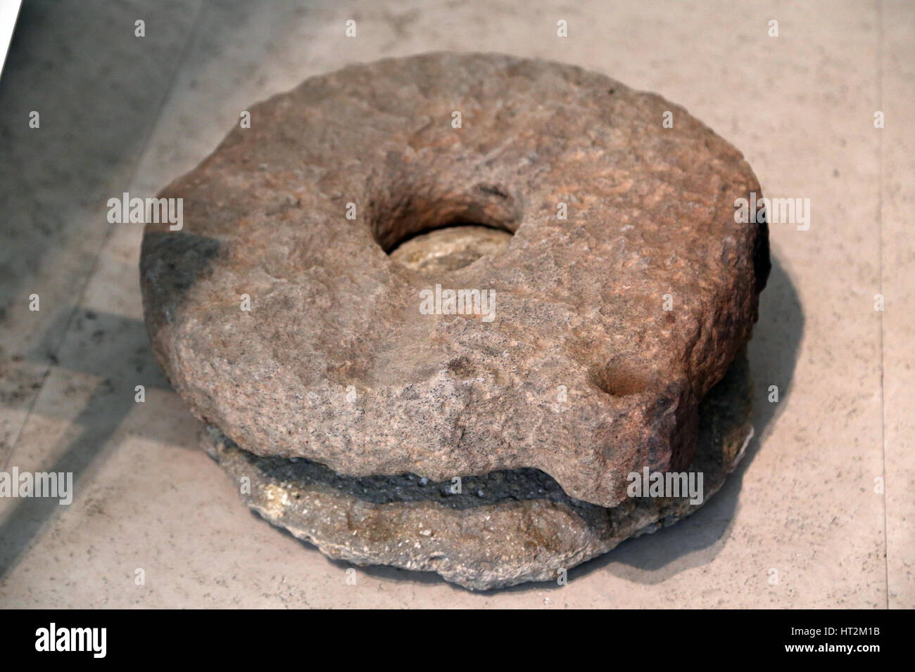 Pre-roman people. Iberian Peninsula. Vettones culture. Rotary grindstone. Sandstone. 4th-2nd century. Hillfort of La Cogotas, Avila, Spain. Stock Photo