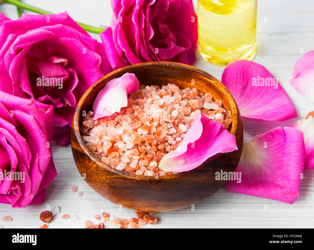 Roses spa setting with bath salt, roses flowers, bath rose oil, still