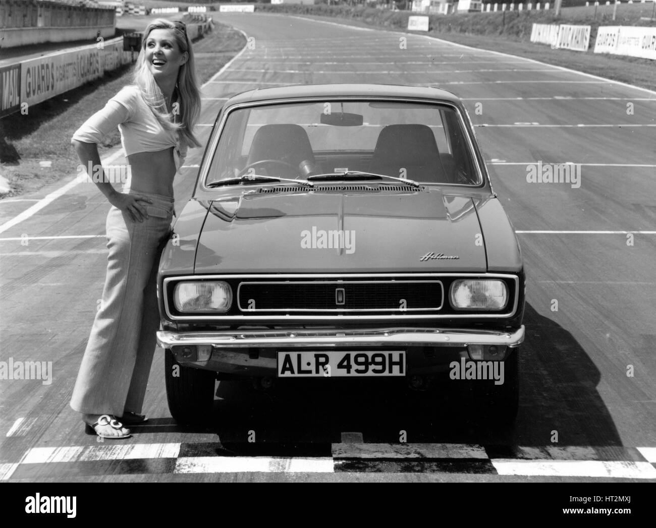 1969 Hillman Hunter GT with female model Artist: Unknown. Stock Photo