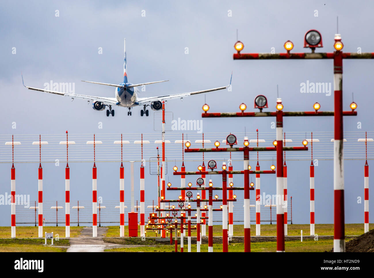 Aviation, plane at Landing approach to DŸsseldorf International Airport, Germany,  Landing runway lighting, Stock Photo