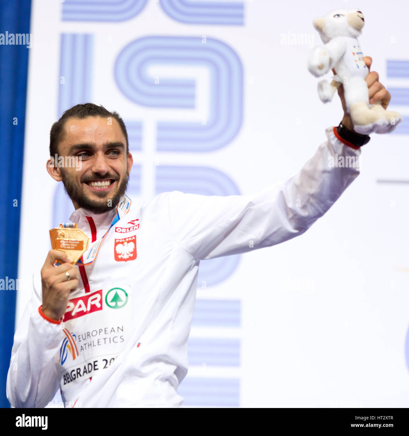 Belgrade, Serbia. 6th Mar, 2017. Poland's gold medal winner Adam Kszczot pose on the podium during the victory ceremony for the men's 800m on day three of the 2017 European Athletics Indoor Championships at the Kombank Arena on March 5, 2017 in Belgrade, Serbia. Credit: Nikola Krstic/Alamy Live News Stock Photo