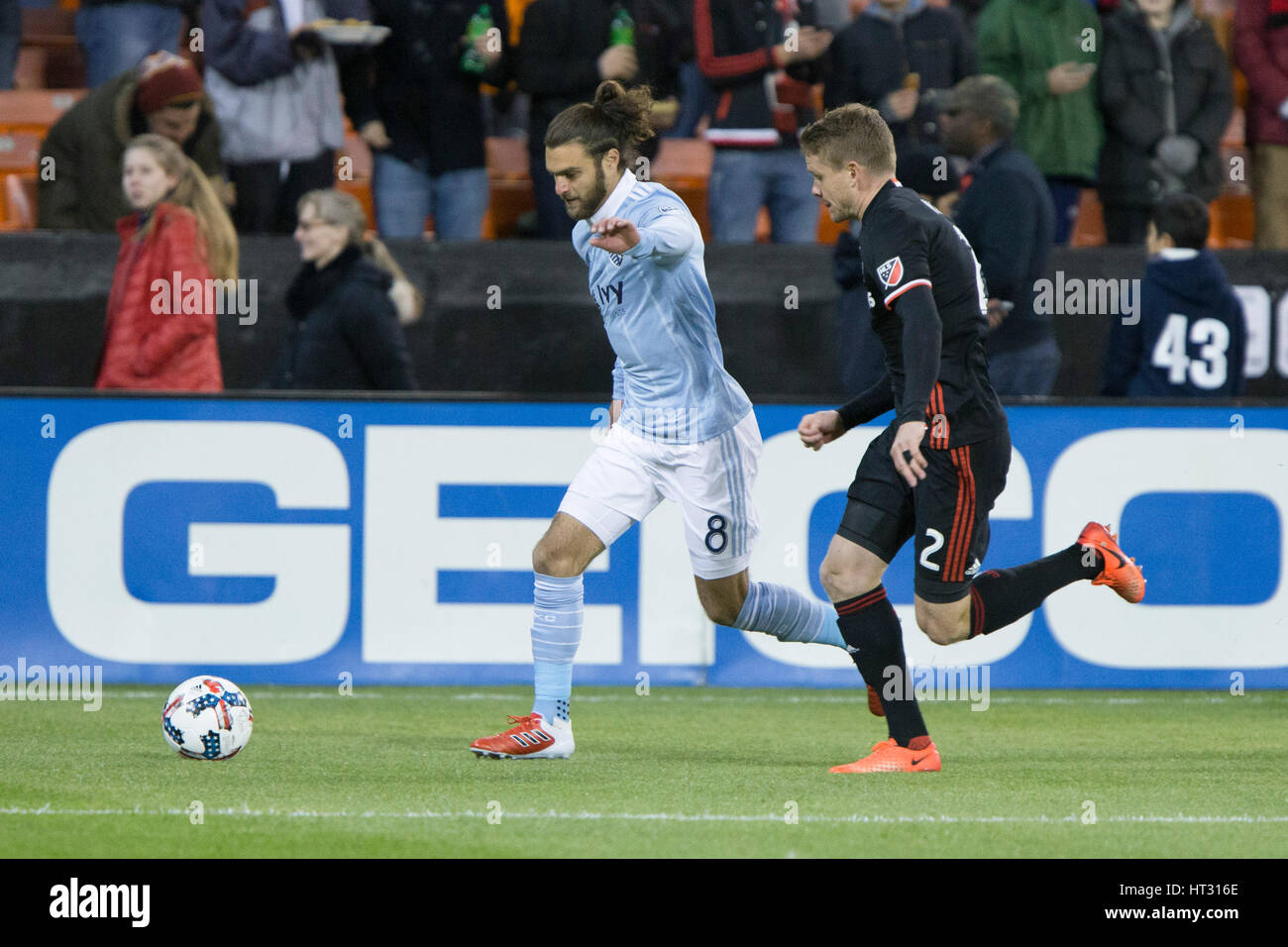 Sporting Kansas City midfielder Graham Zusi (8) and D.C. United defender Taylor Kemp (2) during D.C. United's home opener against Sporting Kansas City which finished 0-0 at RFK Stadium in Washington, D.C. on Saturday March 4, 2017. Stock Photo
