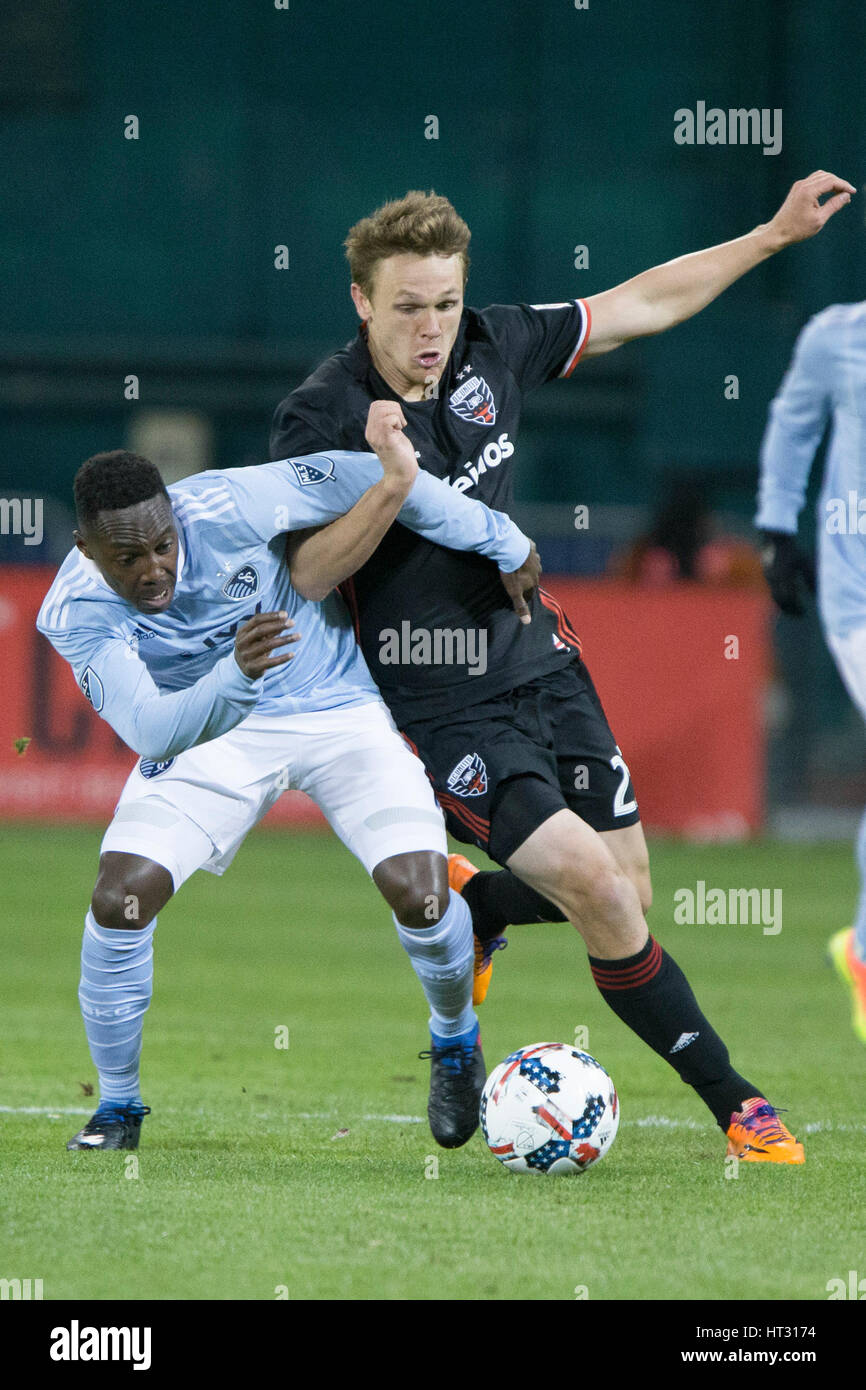 Sporting Kansas City forward Gerso Fernades (7) tackles D.C. United defender Taylor Kemp (2) during D.C. United's home opener against Sporting Kansas City which finished 0-0 at RFK Stadium in Washington, D.C. on Saturday March 4, 2017. Stock Photo