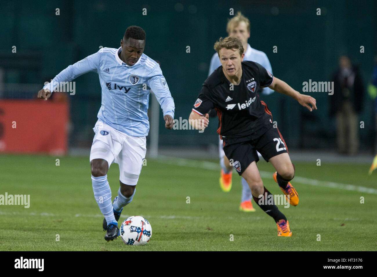 Sporting Kansas City forward Gerso Fernades (7) and D.C. United defender Taylor Kemp (2) during D.C. United's home opener against Sporting Kansas City which finished 0-0 at RFK Stadium in Washington, D.C. on Saturday March 4, 2017. Stock Photo