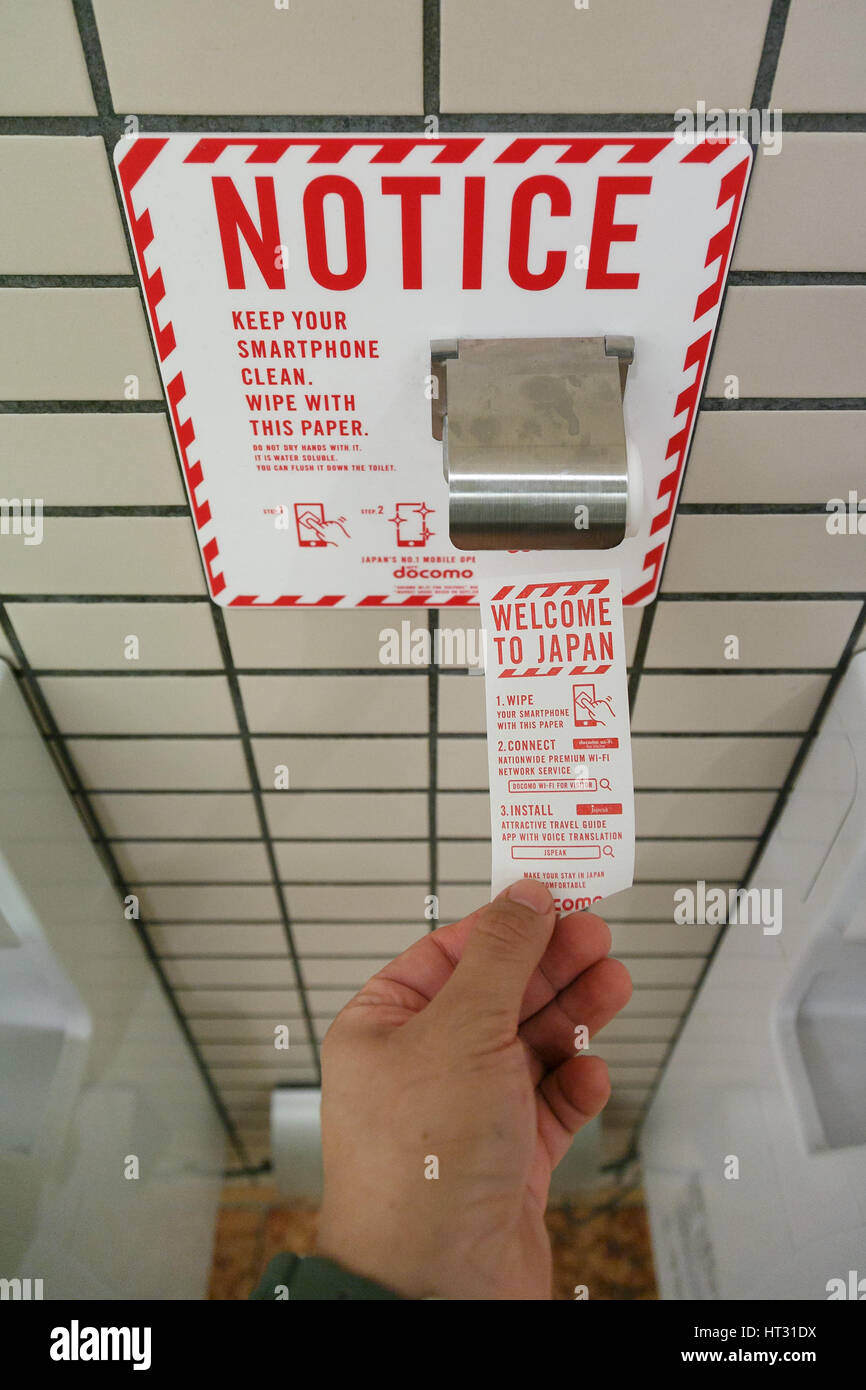 A roll of smartphone screen wipes in a bathroom at Narita International Airport on March 7, 2017, Chiba, Japan. As part of a special promotion, NTT Docomo has installed 86 special roll dispensers in seven restrooms at Narita airport.The sheets give instructions on how to connect to DoCoMo wi-fi and travel guide app JSPEAK. The idea came about because smart phone screens are said to have more germs than toilet seats. The rolls are available until March 15, 2017. Credit: Rodrigo Reyes Marin/AFLO/Alamy Live News Stock Photo
