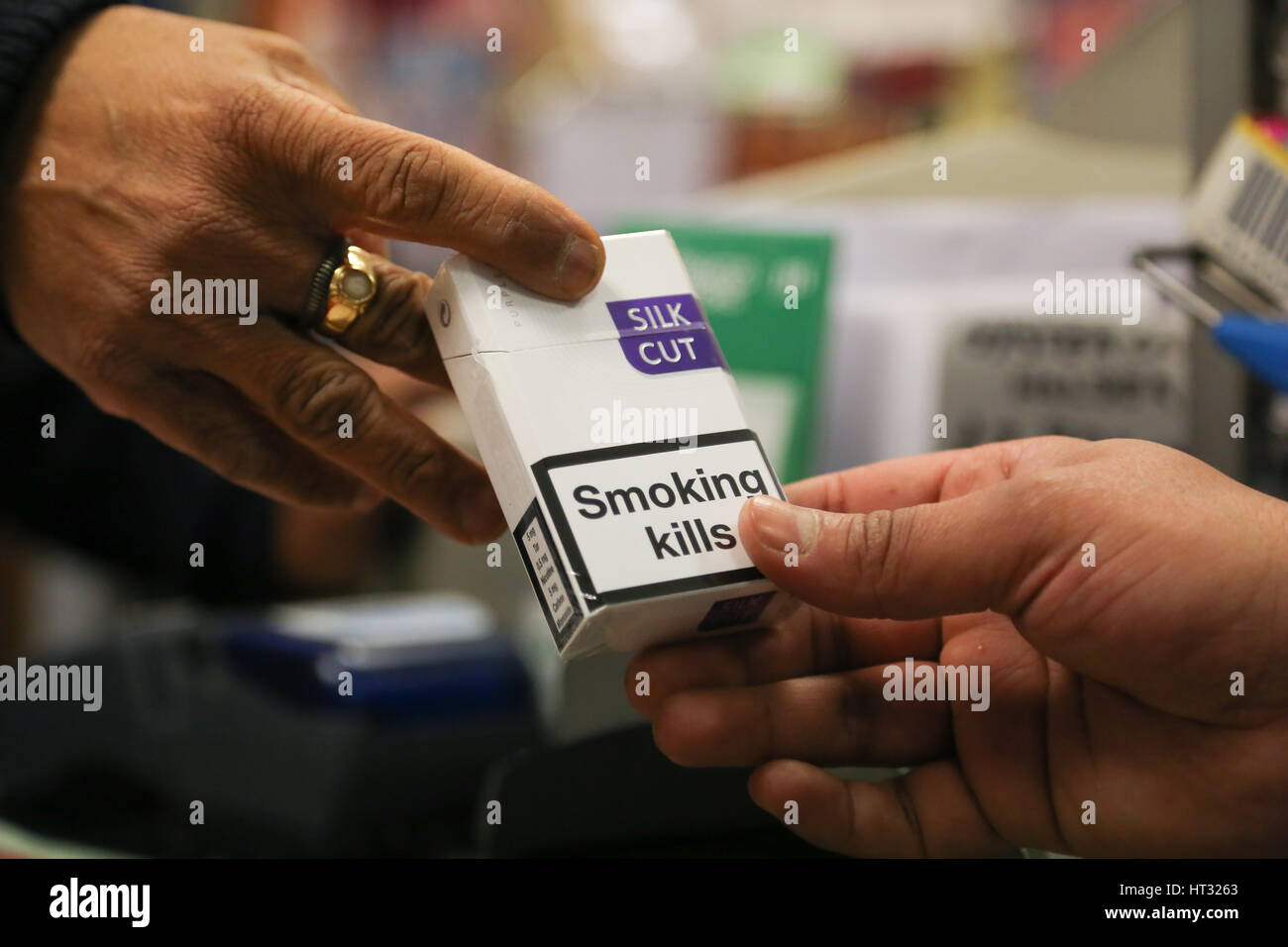 London, UK. 7th Mar, 2017. Customer buys a packet of cigarettes. Today