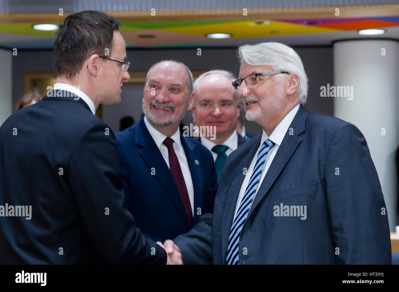 March 6, 2017 - Brussels, Belgium: Hungarian Minister of Foreign Affairs & External Economy Peter Szijjarto (L) is talking with the Polish Minister of National Defense Antoni Macierewicz (C) and the Polish Minister of Foreign Affairs Witold Waszczykowski (R) during an EU Defense and foreign affairs Ministers meeting in the Europa building, the EU Council headquarter. - NO WIRE SERVICE- Photo: Thierry Monasse/dpa Photo: Thierry Monasse/dpa Stock Photo