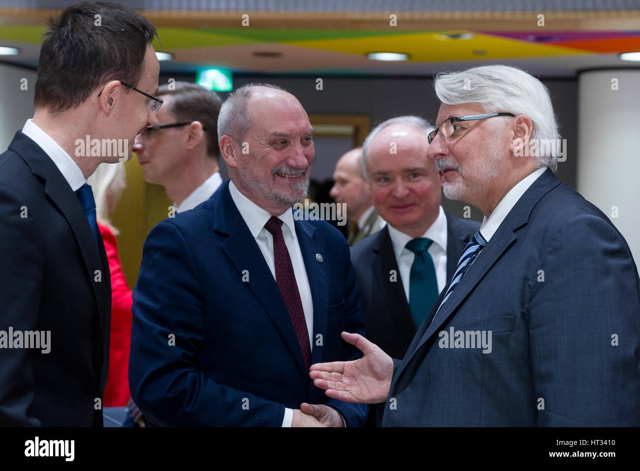 March 6, 2017 - Brussels, Belgium: Hungarian Minister of Foreign Affairs & External Economy Peter Szijjarto (L) is talking with the Polish Minister of National Defense Antoni Macierewicz (C) and the Polish Minister of Foreign Affairs Witold Waszczykowski (R) during an EU Defense and foreign affairs Ministers meeting in the Europa building, the EU Council headquarter. - NO WIRE SERVICE- Photo: Thierry Monasse/dpa Photo: Thierry Monasse/dpa Stock Photo