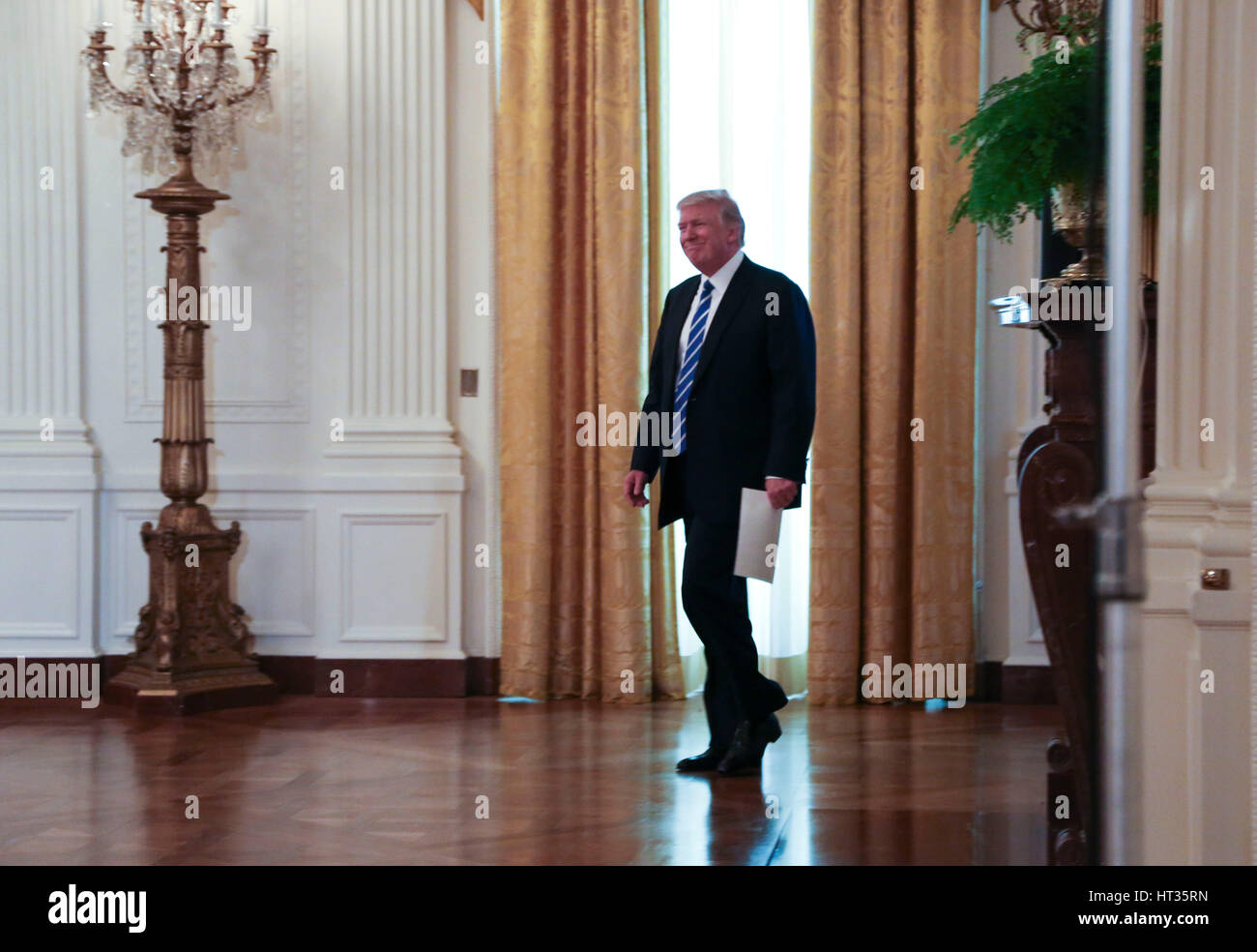 Washington, DC, USA. 7th Mar, 2017. United States President Donald Trump arrives to lead a meeting with the U.S. House Republican Deputy Whip Team, in the East Room of the White House, Washington, DC, March 7, 2017. Credit: MediaPunch Inc/Alamy Live News Stock Photo