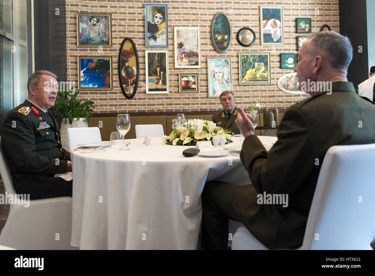 Antalya, Turkey. 7th Mar, 2017. U.S. Joint Chiefs Chairman Gen. Joseph Dunford, right, with Turkish Gen. Hulusi Akar and Russian Gen. Valery Gerasimov, center, during a working lunch March 7, 2017 in Antalya, Turkey. The three chiefs of defense are meeting to discuss operations in Syria. Credit: Planetpix/Alamy Live News Stock Photo