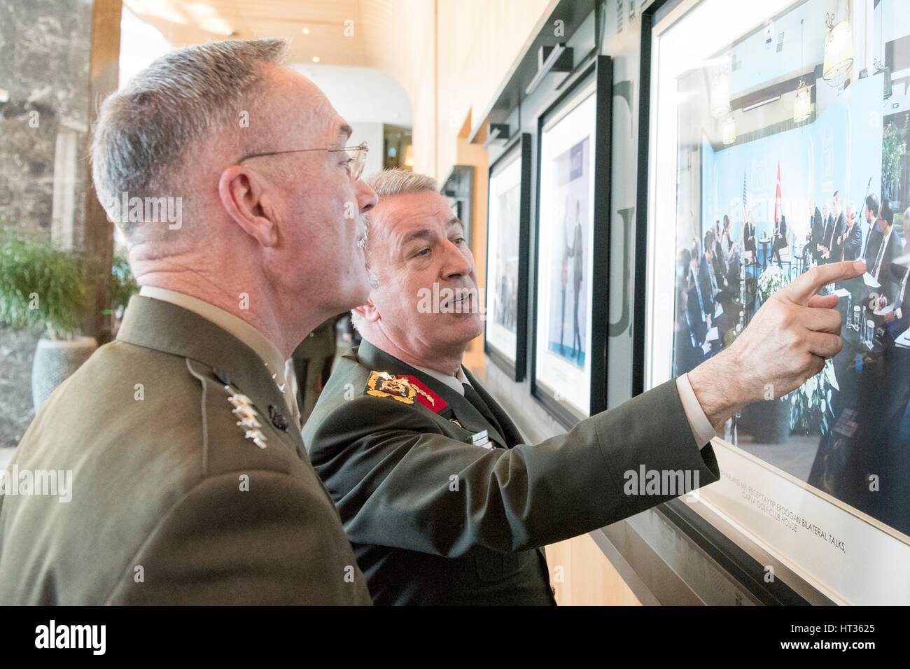 Antalya, Turkey. 7th Mar, 2017. U.S. Joint Chiefs Chairman Gen. Joseph Dunford, left, is show a photo by Turkish Gen. Hulusi Akar prior to meetings with Russian Gen. Valery Gerasimov March 7, 2017 in Antalya, Turkey. The three chiefs of defense are meeting to discuss operations in Syria. Credit: Planetpix/Alamy Live News Stock Photo