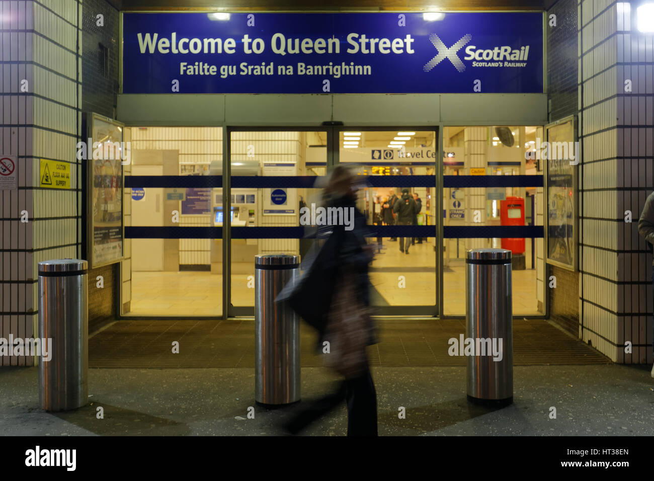 Queen Street station Glasgow tourists waiting for trains night Stock Photo