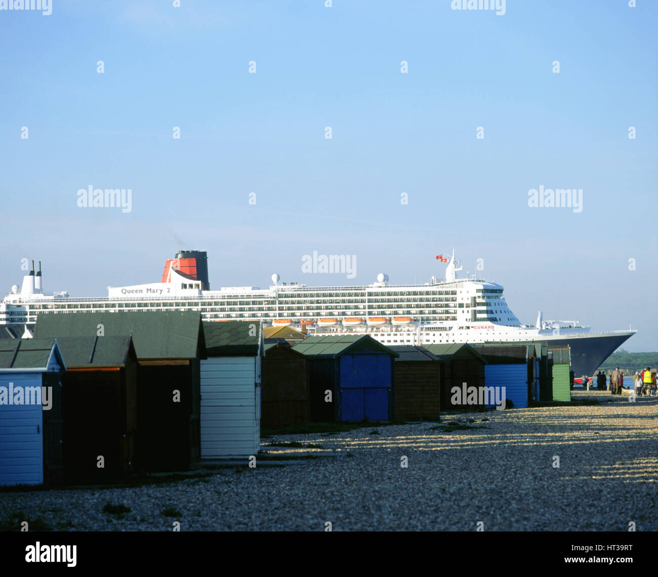 Queen Mary II sails past Beach Huts, Calshot May 2004. Artist: Unknown. Stock Photo