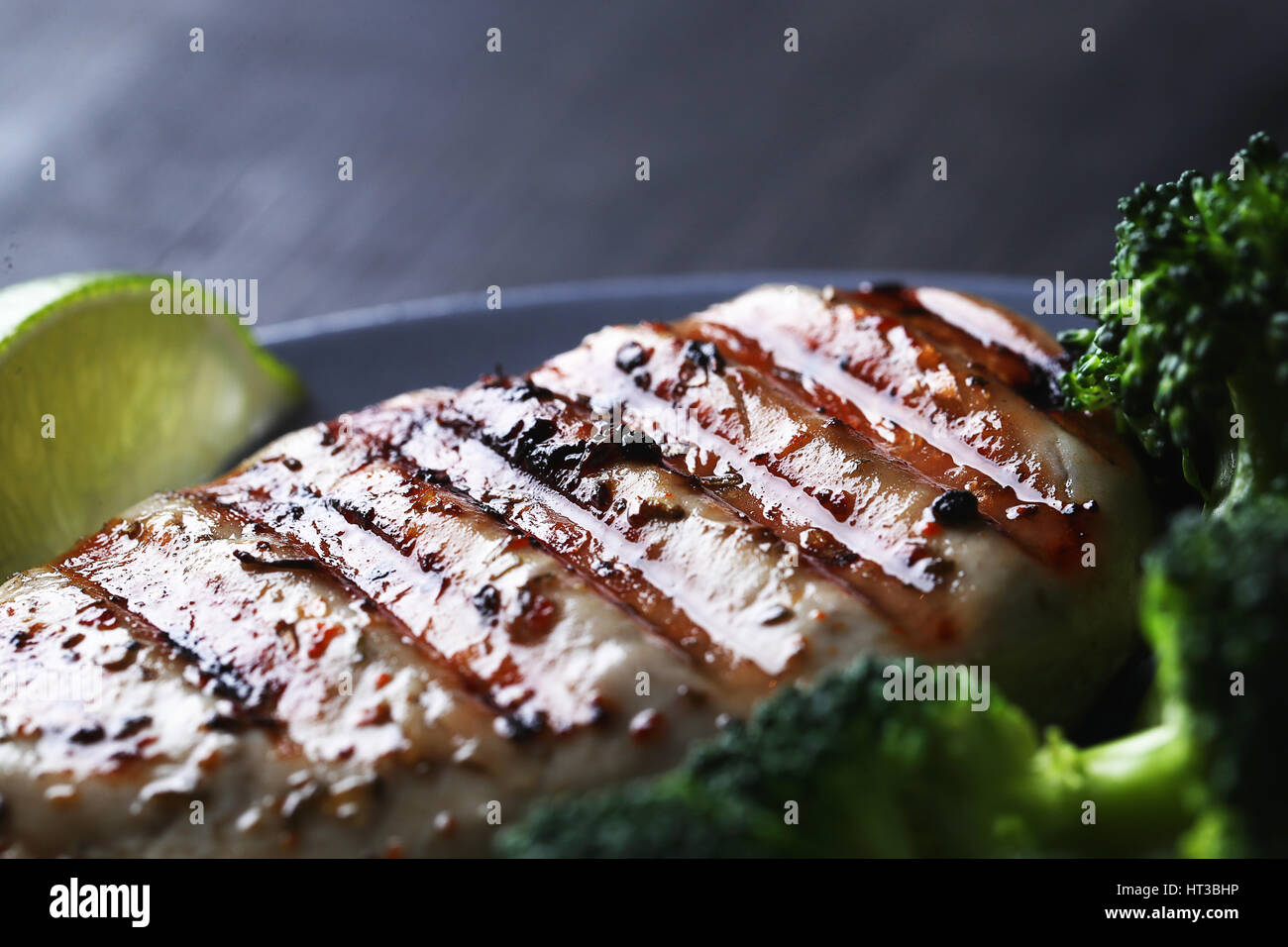 Dinner. Fried chicken fillet with vegetables Stock Photo - Alamy