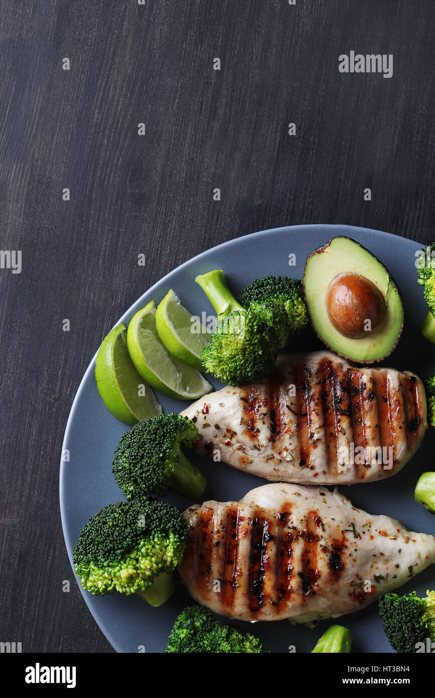 Dinner. Fried chicken fillet with vegetables Stock Photo - Alamy