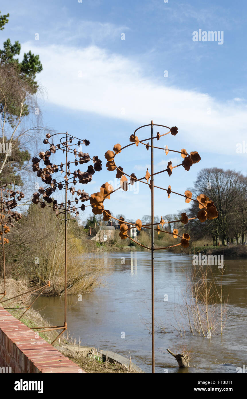 Decorative metal sculptures on the bank of the River Wye in the Courtyard cafe De Koffie Pot Stock Photo