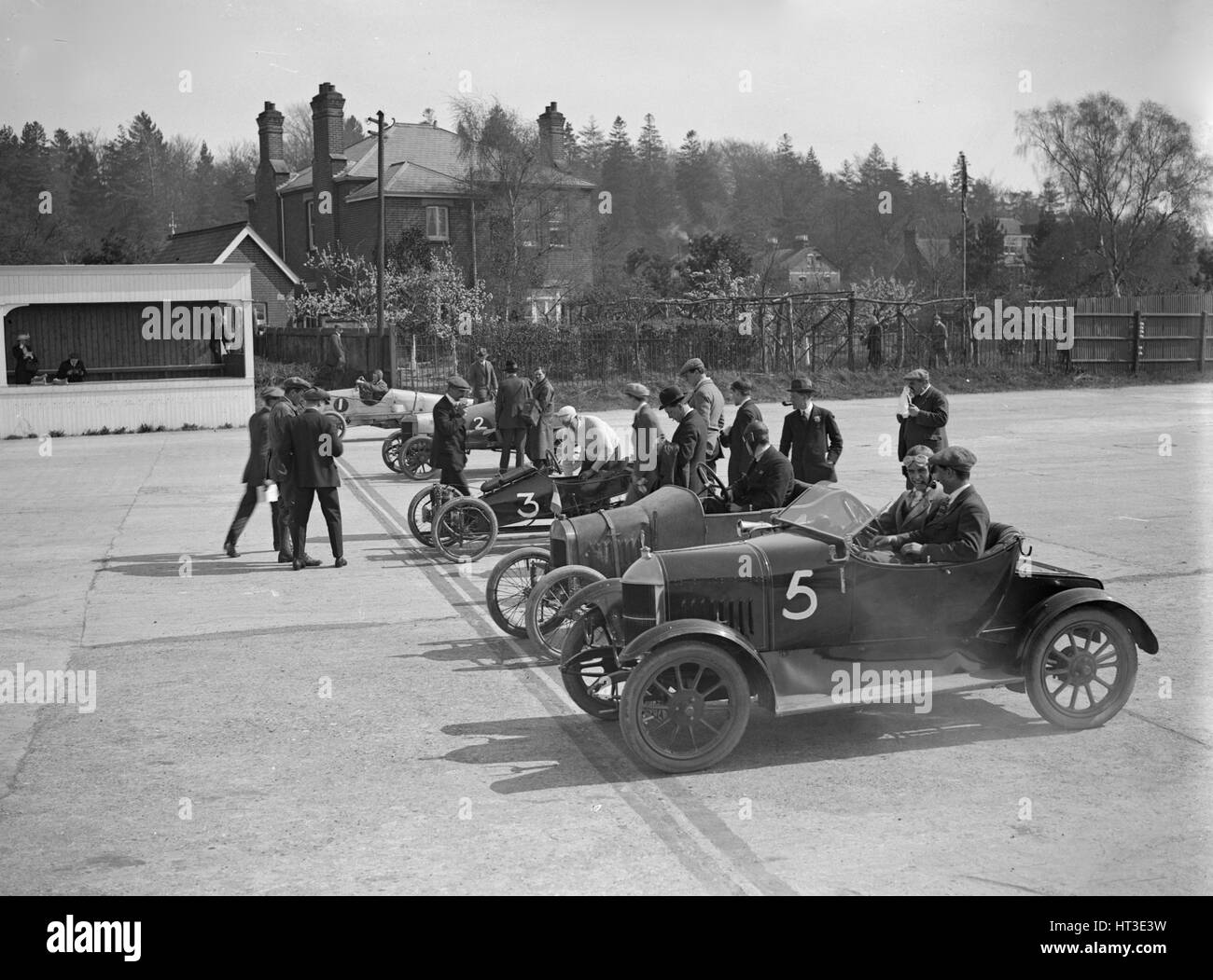 Morris, Morgan and Crouch cars on the start line of a motor race, Brooklands, 1914. Artist: Bill Brunell. Stock Photo