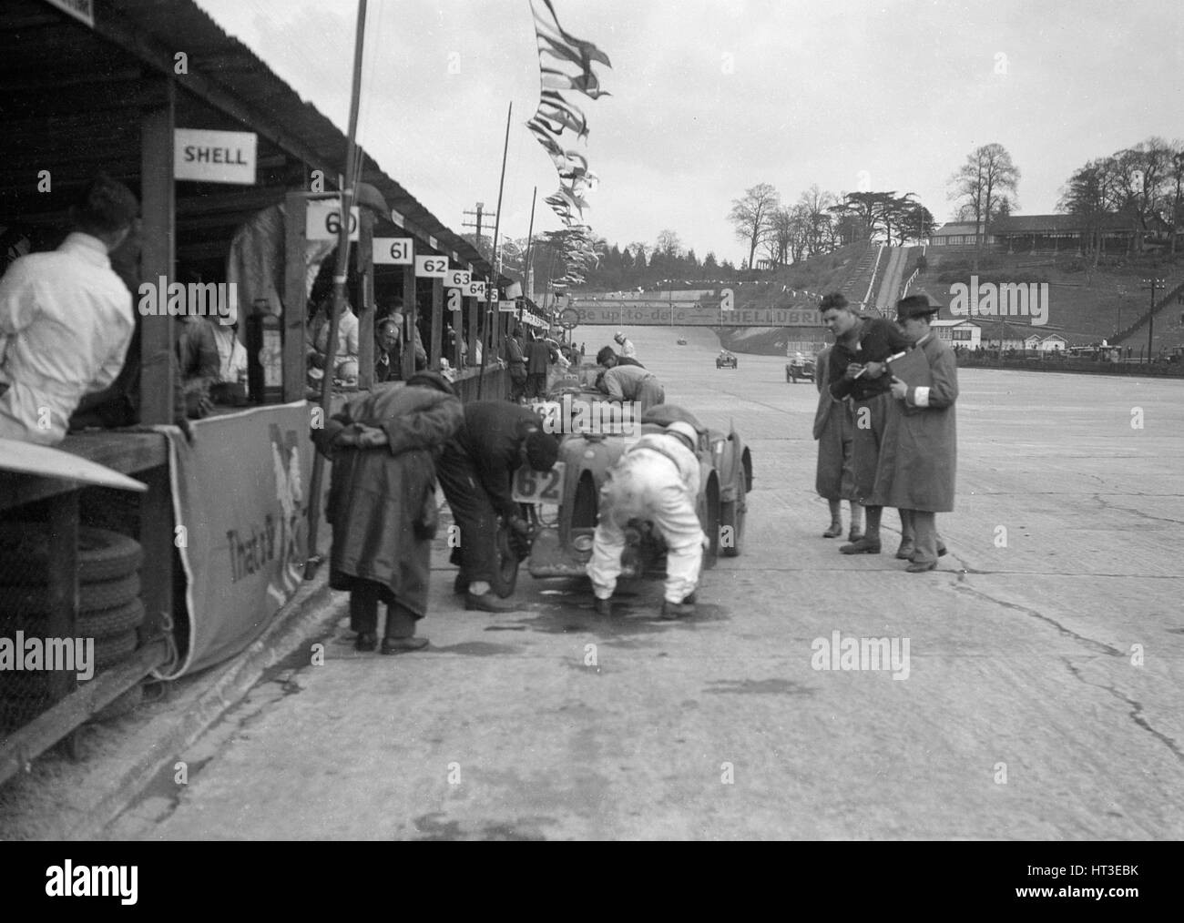 N Black and CW Fiennes' MG C type in the pits at the JCC Double Twelve race, Brooklands, May 1931. Artist: Bill Brunell. Stock Photo