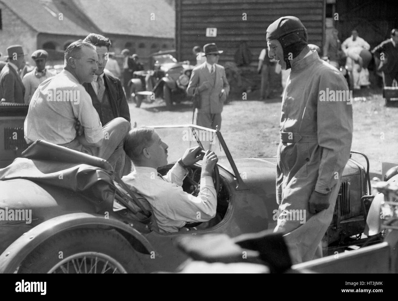 Earl Howe beside a Riley 9 Brooklands at the MAC Shelsley Walsh Hillclimb, Worcestershire, c1930s. Artist: Bill Brunell. Stock Photo