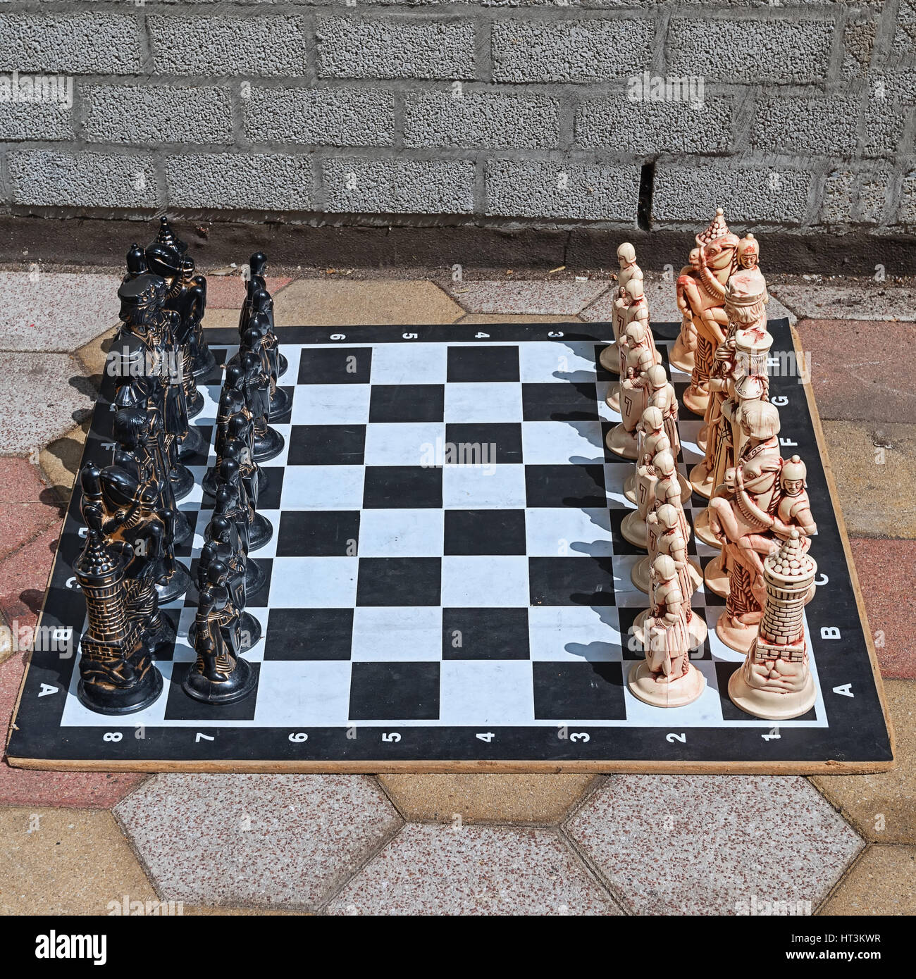 Chess pieces in starting position on a wooden Board Stock Photo by  ©Rostislavv 141334490