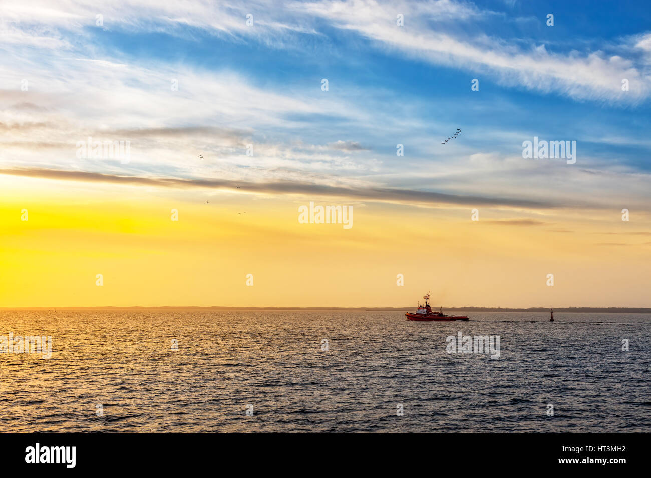 Lone tugboat at sea in the morning. Stock Photo