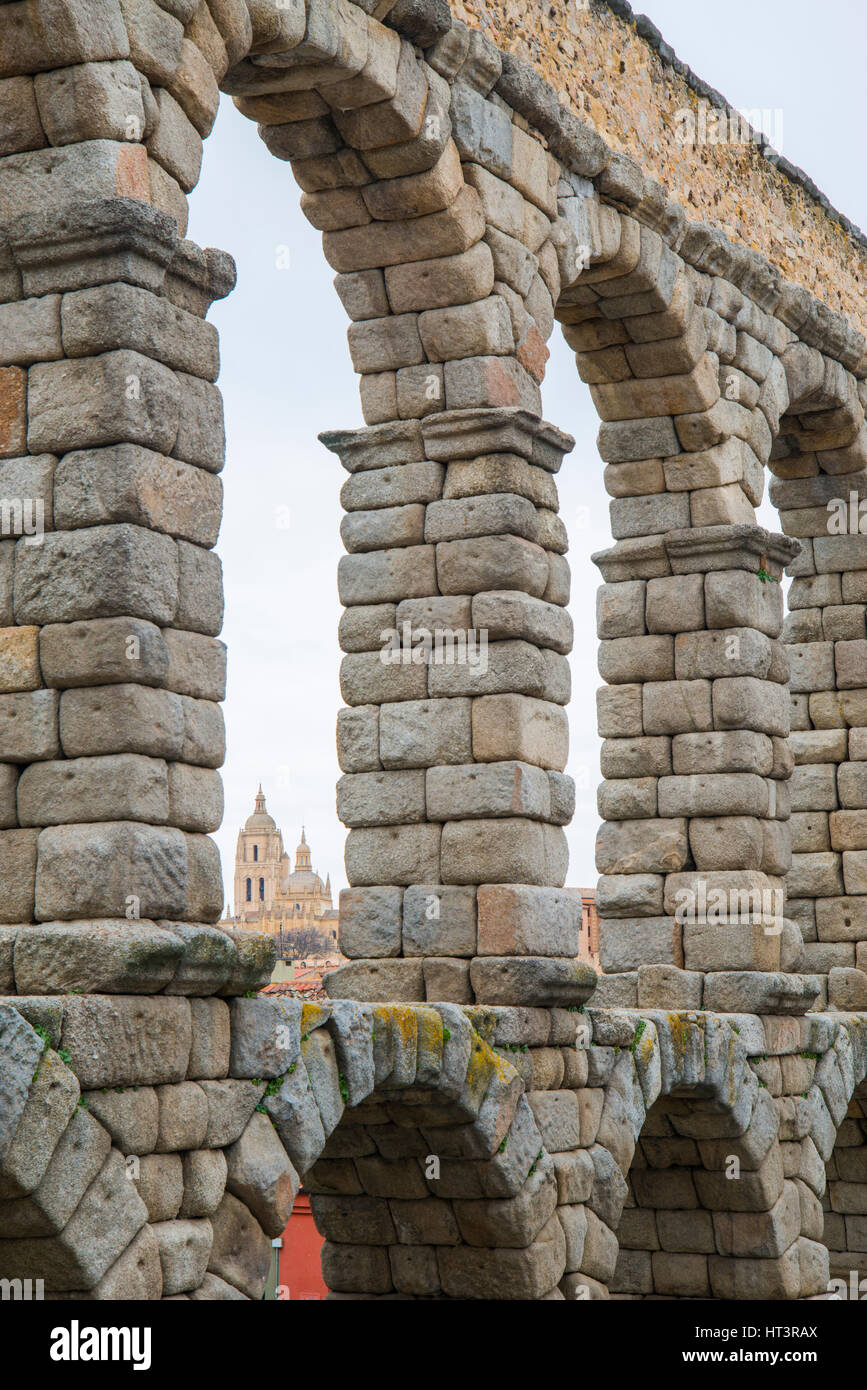 Cathedral viewed through the arches of the Roman Aqueduct. Segovia, Spain. Stock Photo