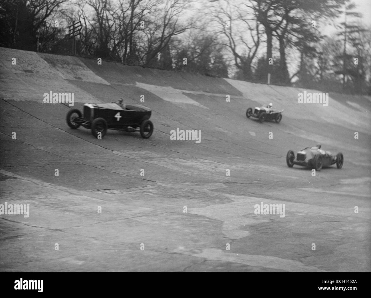 Vauxhall, Riley and Amilcar racing at a BARC meeting, Brooklands, Surrey, 1931 Artist: Bill Brunell. Stock Photo