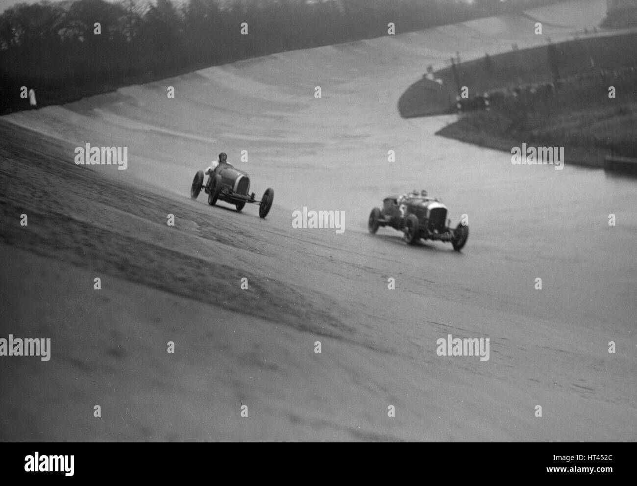 Bugatti and Bentley of Eddie Hall racing at a BARC meeting, Brooklands, Surrey, 1931 Artist: Bill Brunell. Stock Photo