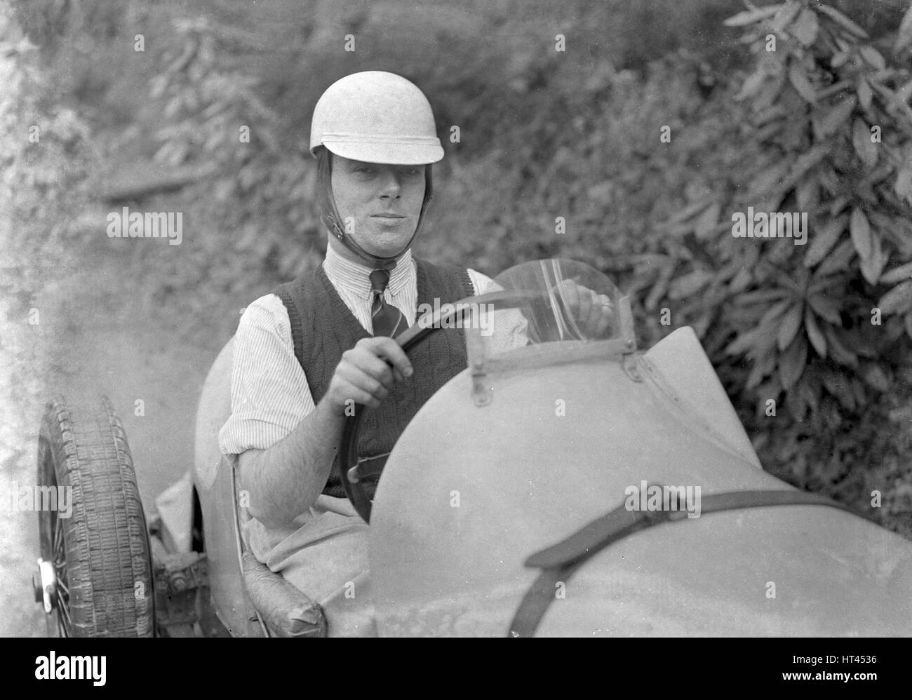 Charles Mortimer behind the wheel of an offset-bodied single-seater MG KN Special, c1930s Artist: Bill Brunell. Stock Photo