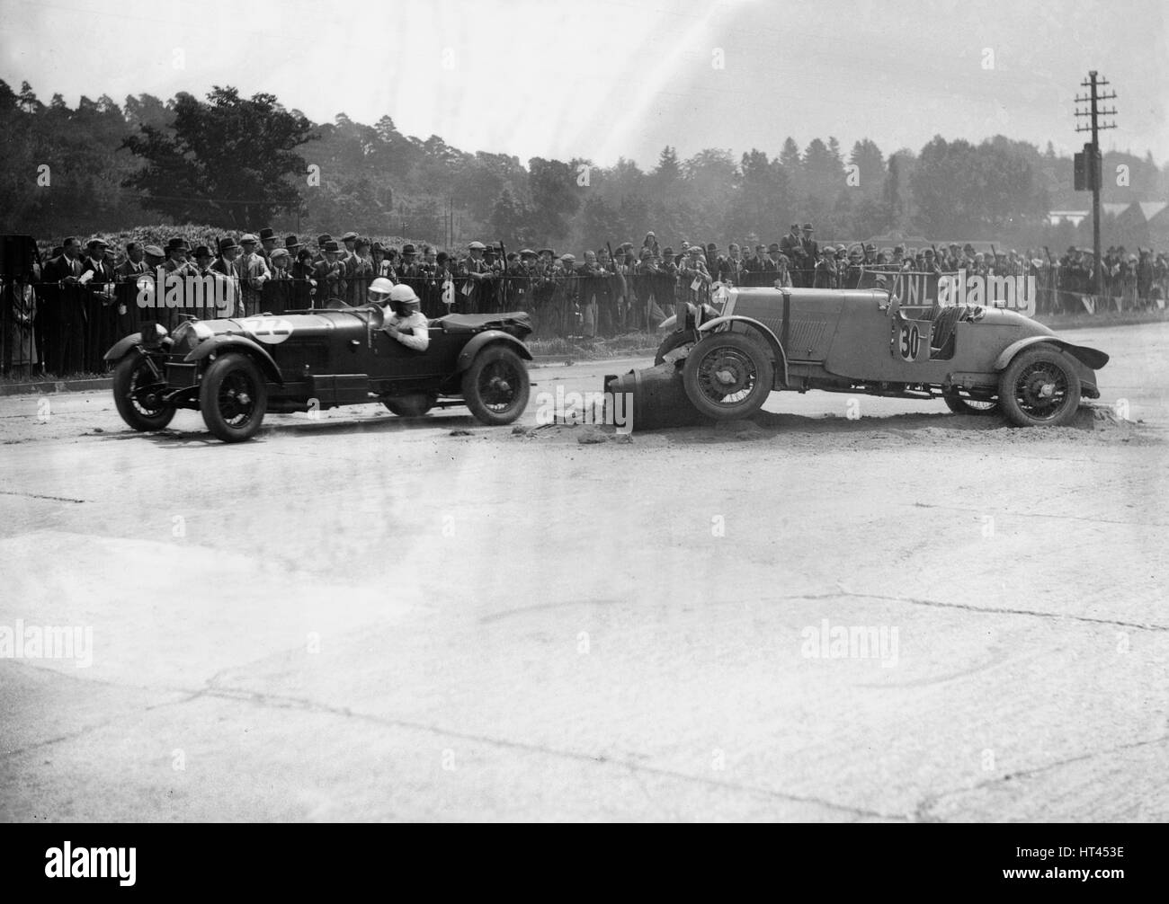 Alfa Romeo passing R Childe's crashed Lea-Francis, BARC 6-Hour Race, Brooklands, Surrey, 1929, Artist: Bill Brunell. Stock Photo