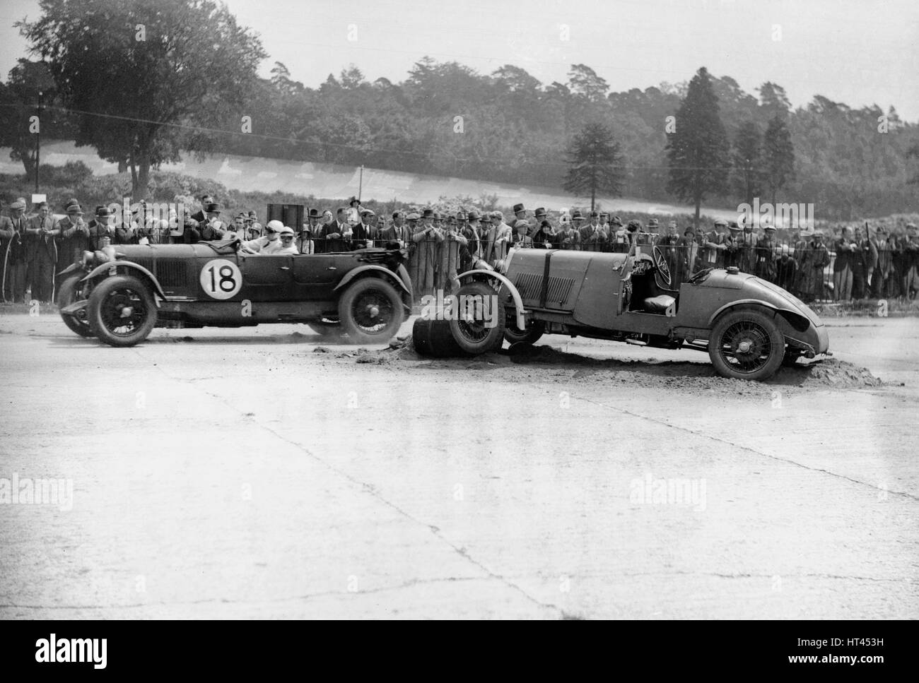 Lagonda passing R Childe's crashed Lea-Francis, BARC 6-Hour Race, Brooklands, Surrey, 1929, Artist: Bill Brunell. Stock Photo