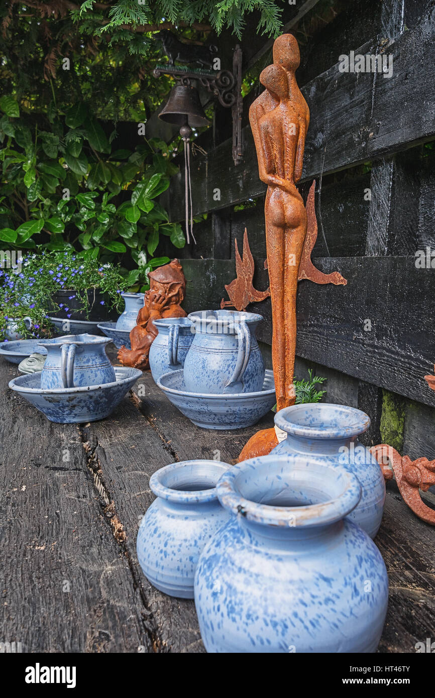 Giethoorn, Netherlands – June 29, 2016:  Decorative elements on the shelf in the shade garden. Stock Photo