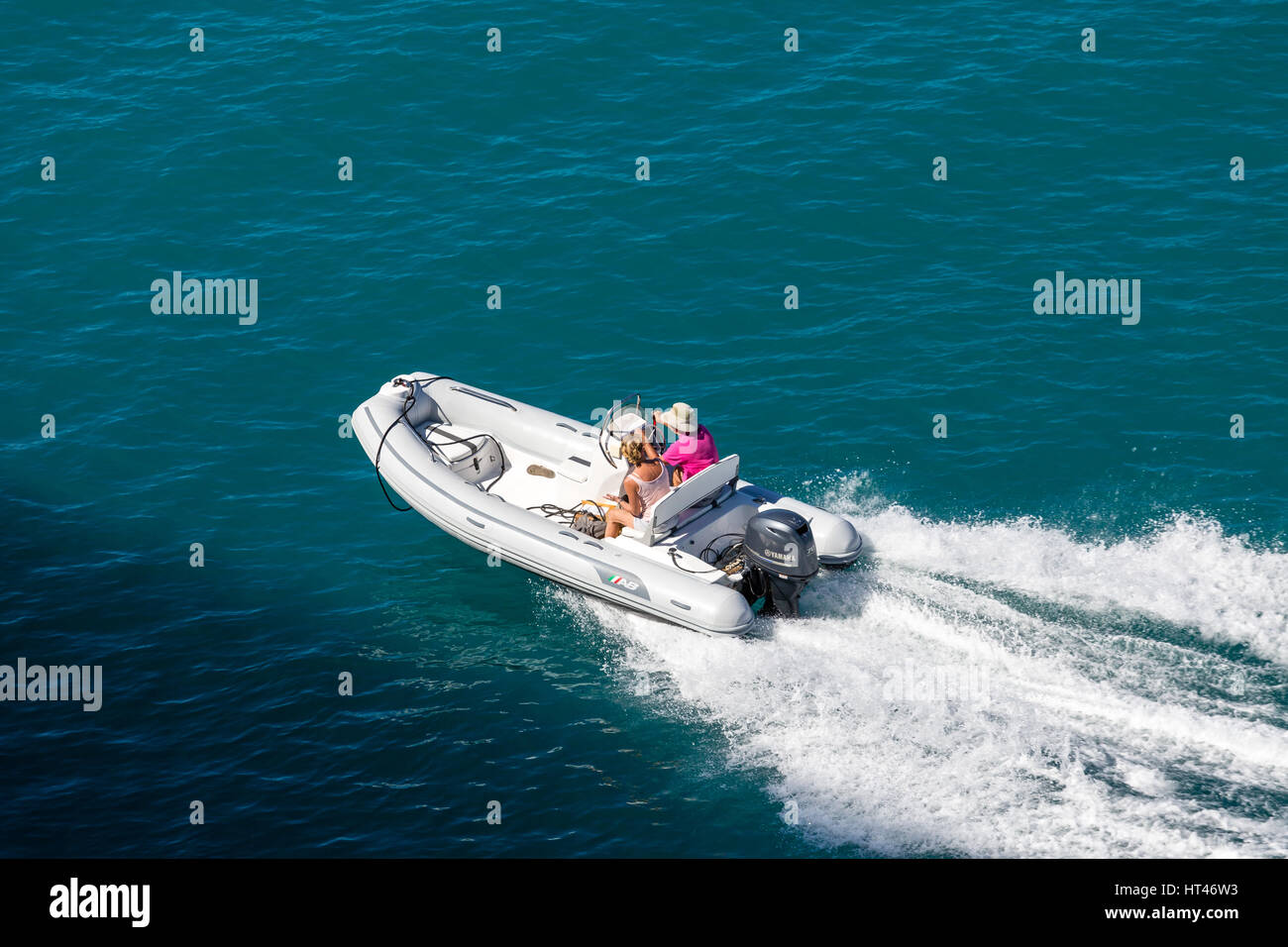 Couple in Rubber Dinghy Stock Photo - Alamy