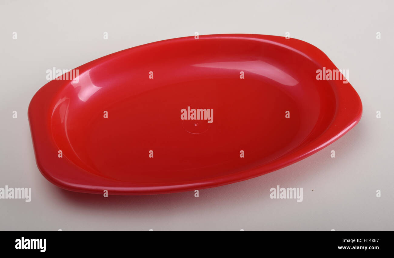 Red Plasticware Red plastic tableware food container isolated over the white background ...