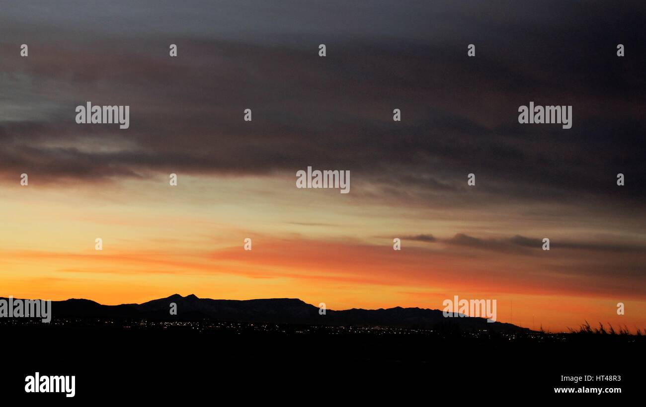 mountain sunrise on sandia mountains in new mexico Stock Photo