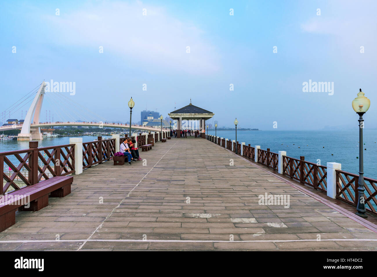TAIPEI, TAIWAN - JANUARY 05: Pier in Fishermans wharf area in Tamsui where people come to relax and take photos on January 05, 2017 in Taipei Stock Photo