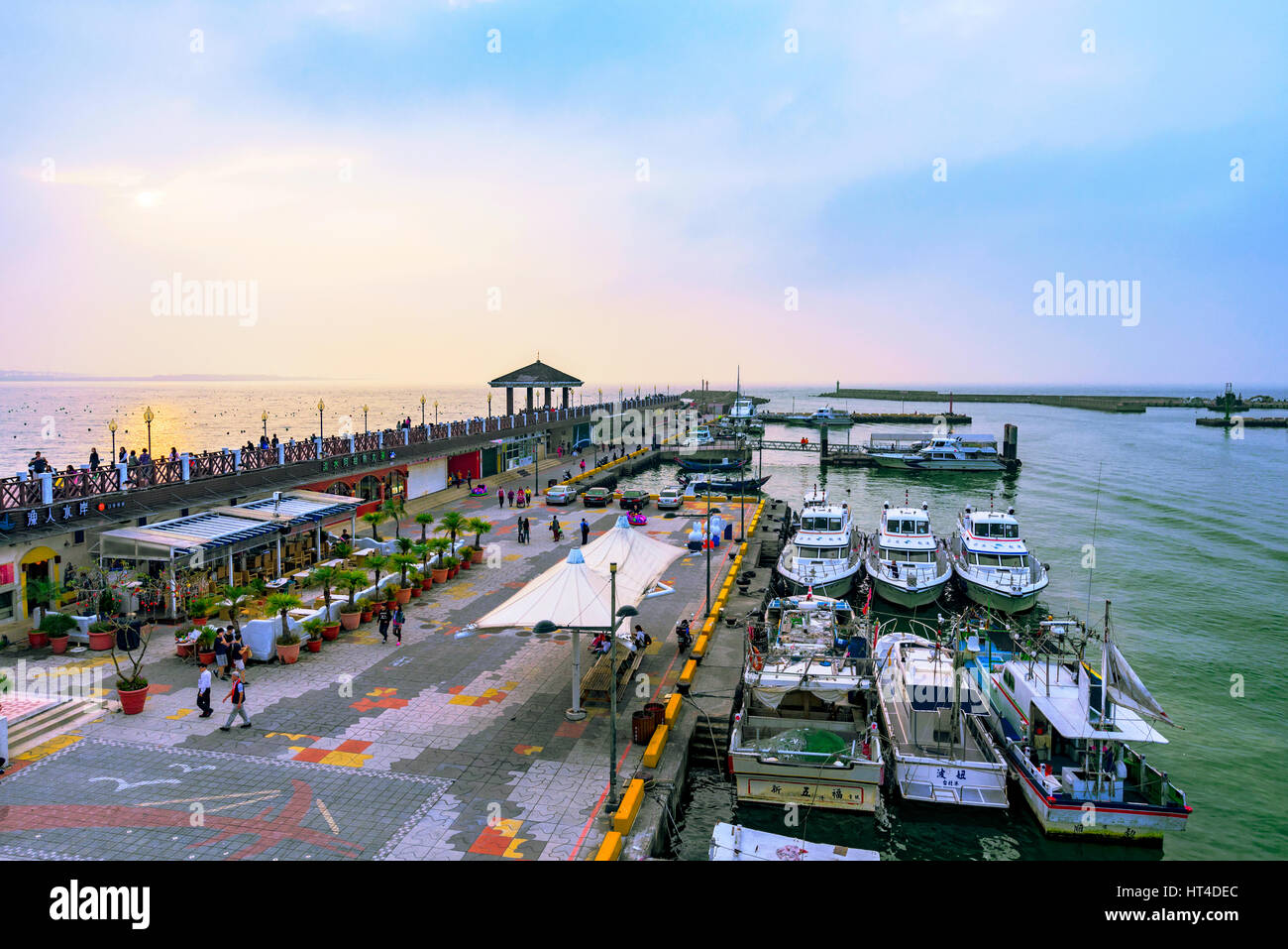 TAIPEI, TAIWAN - JANUARY 05: View of Fisherman's wharf waterfront area with boats in Tamsui a popular tourist destinatination on January 05, 2017 in T Stock Photo