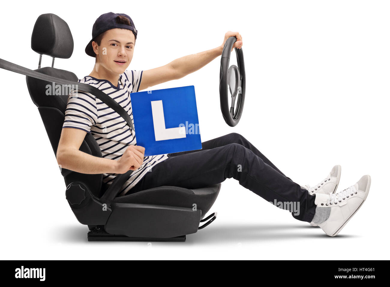 Teenage driver in a car seat showing an L-sign isolated on white background Stock Photo