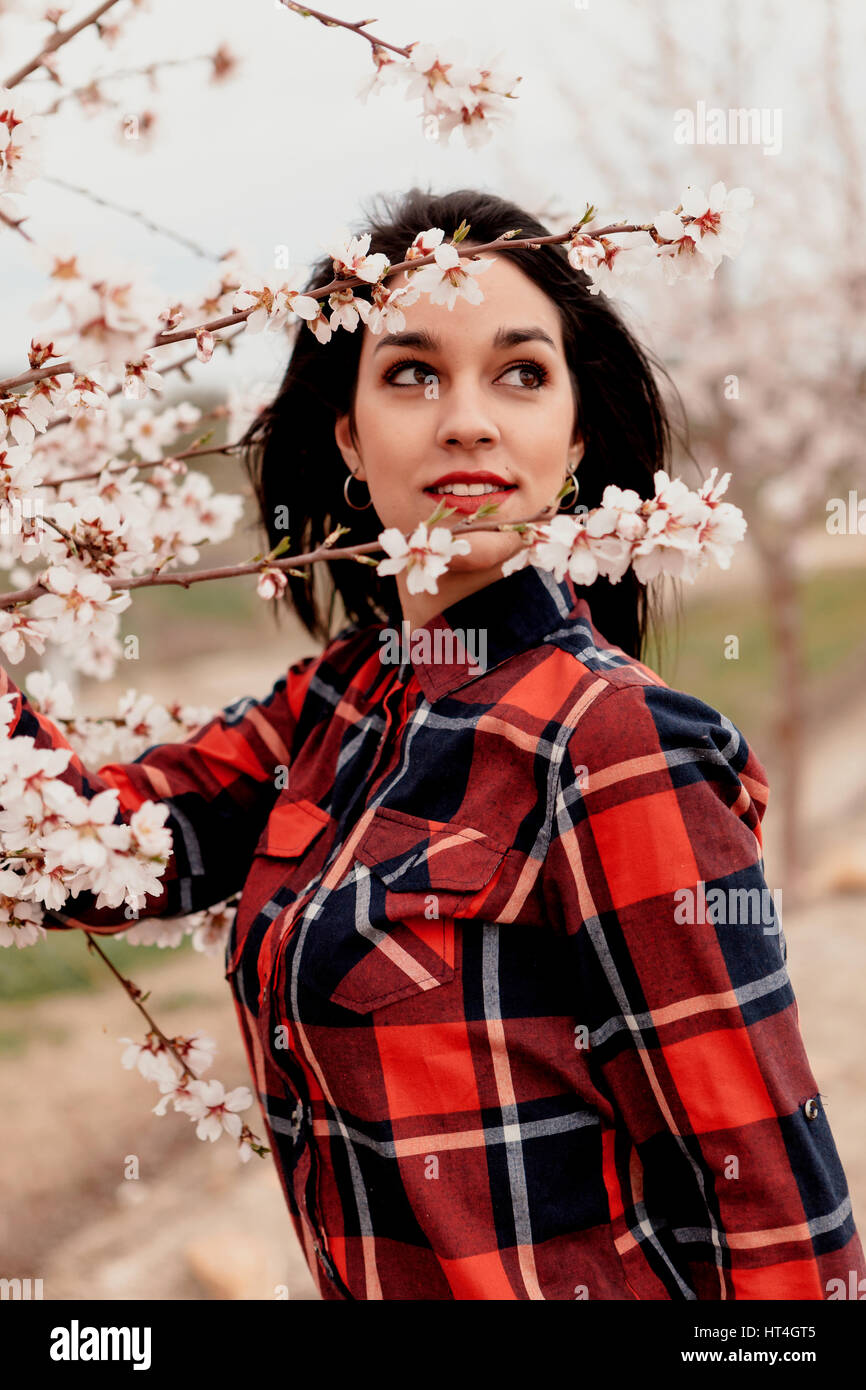 girl near a almond tree with many flowers Stock Photo Alamy