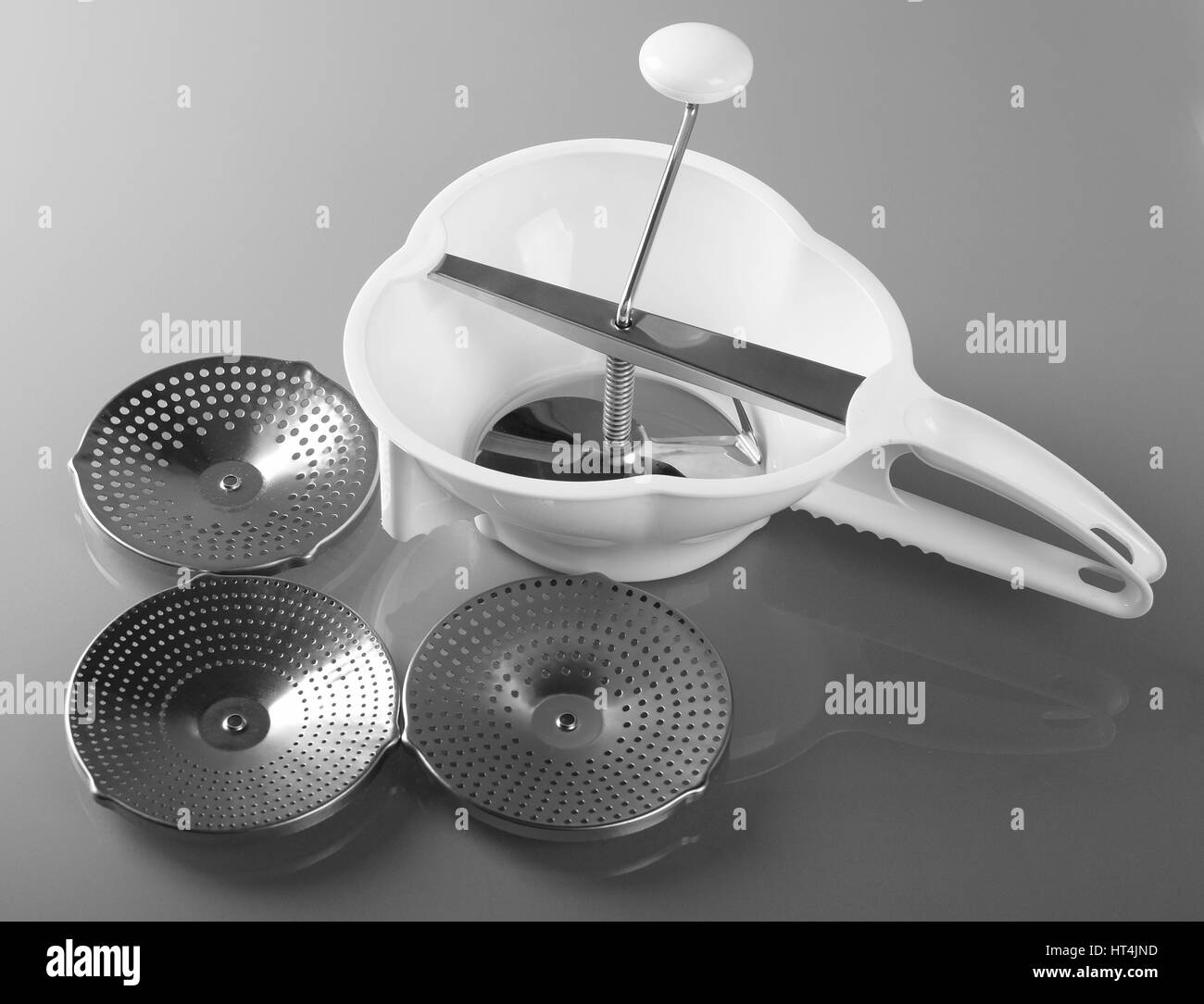 Rotary grater with a crank handle and accessories Stock Photo Alamy
