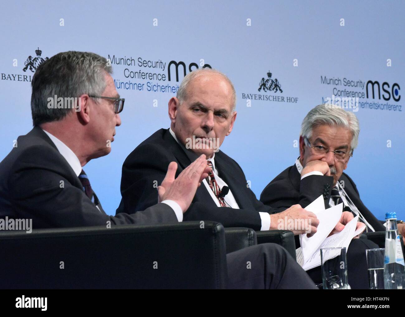 German Federal Minister of the Interior Thomas de Maiziere (left), U.S. Homeland Security Secretary John Kelly, and Pakistani Minister of Defense Khawaja Muhammad Asif participate in a global forum discussion during the 2017 Munich Security Conference February 18, 2017 in Munich, Germany. Stock Photo