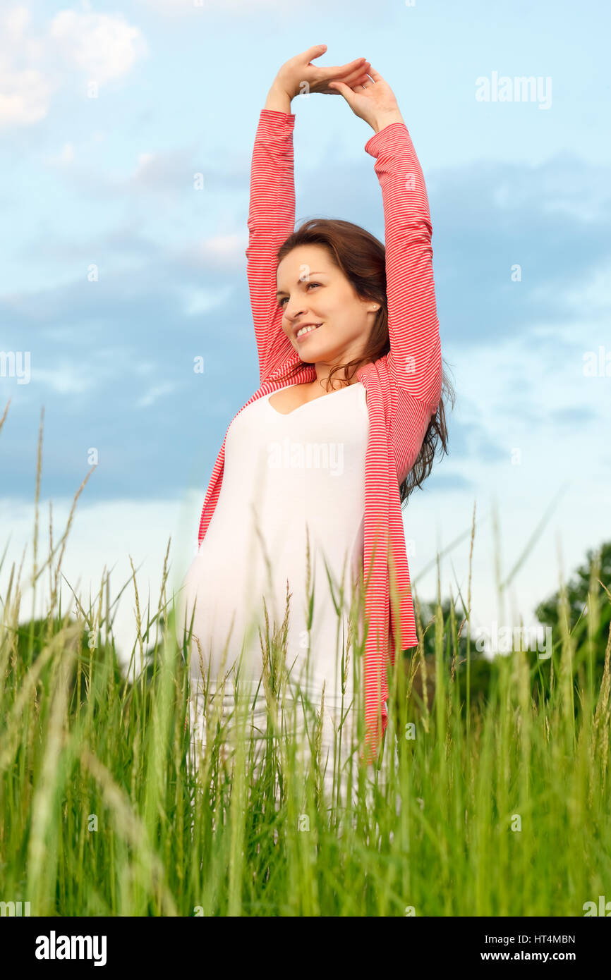 Beautiful pregnant woman in the park Stock Photo - Alamy