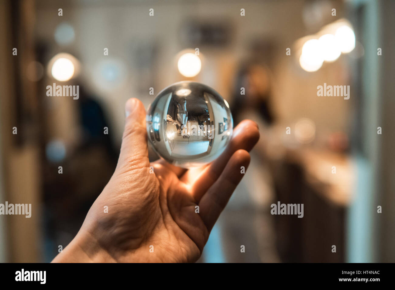 man holding a clean glass bowl in the room Stock Photo Alamy