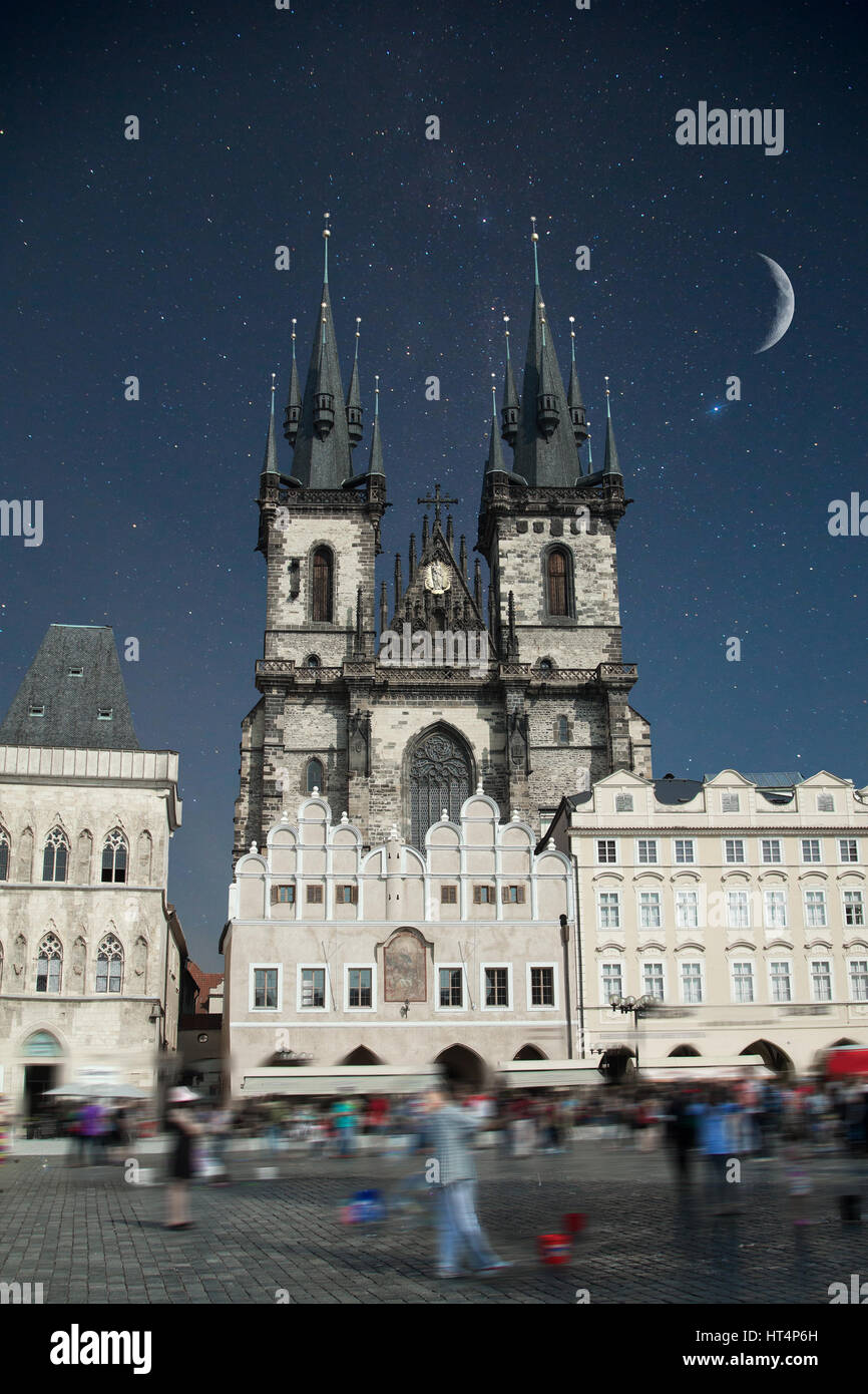 Prague Old town square, Tyn Cathedral. under sunlight. At night the stars shine and the moon. Stock Photo