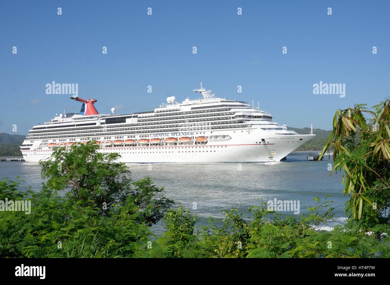 AMBER COVE DOMINICAN REPUBLIC 16 FEBRUARY  2016: Carnival Splendor Cruise ship in port with trees in foreground Stock Photo