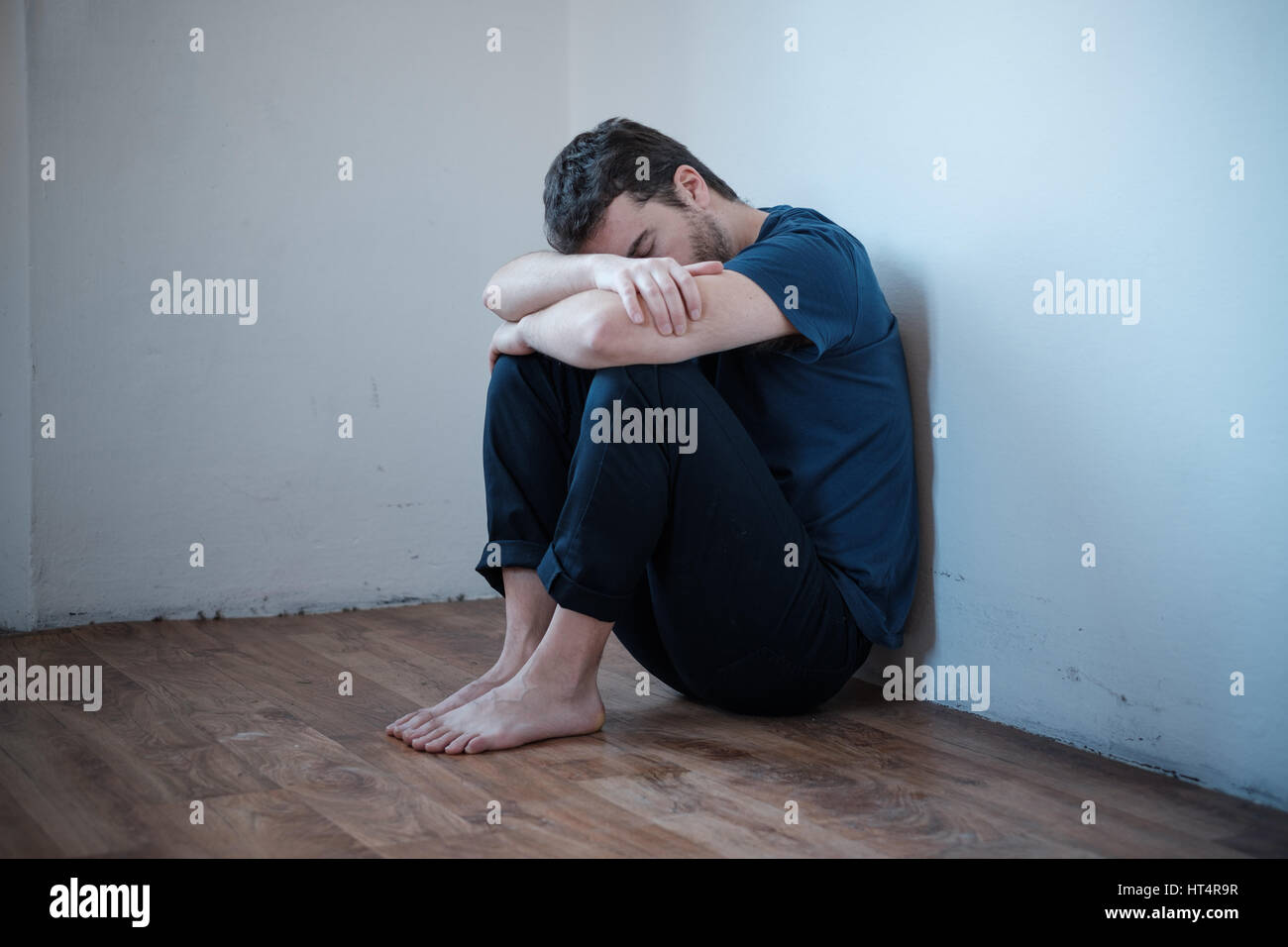 Desperate man in trouble feeling alone and depressed Stock Photo - Alamy