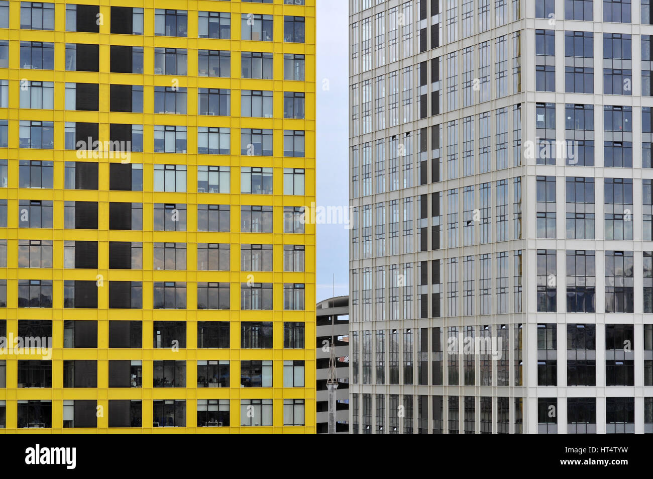 New business colorful buildings in the city. Abstract backgruond template. Empty constructions from concrete metall and glass. Stock Photo