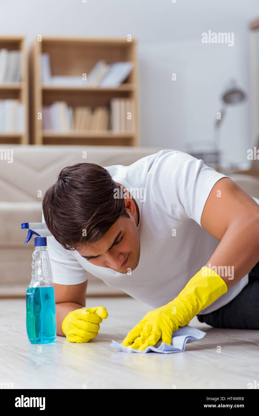 Man husband cleaning the house helping wife Stock Photo - Alamy